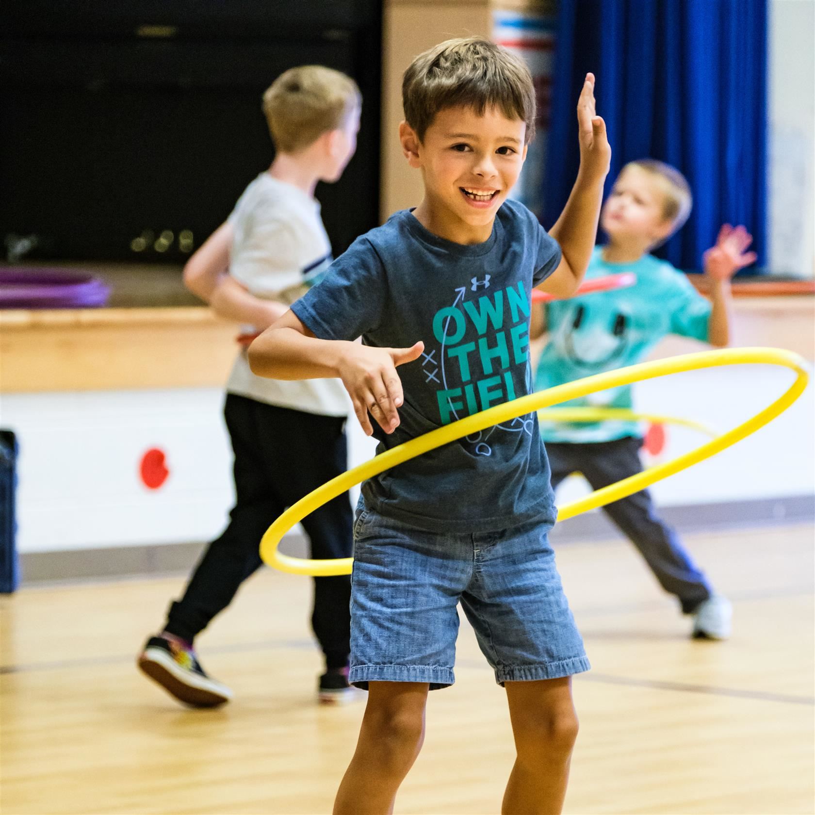  boy using a hula hoop
